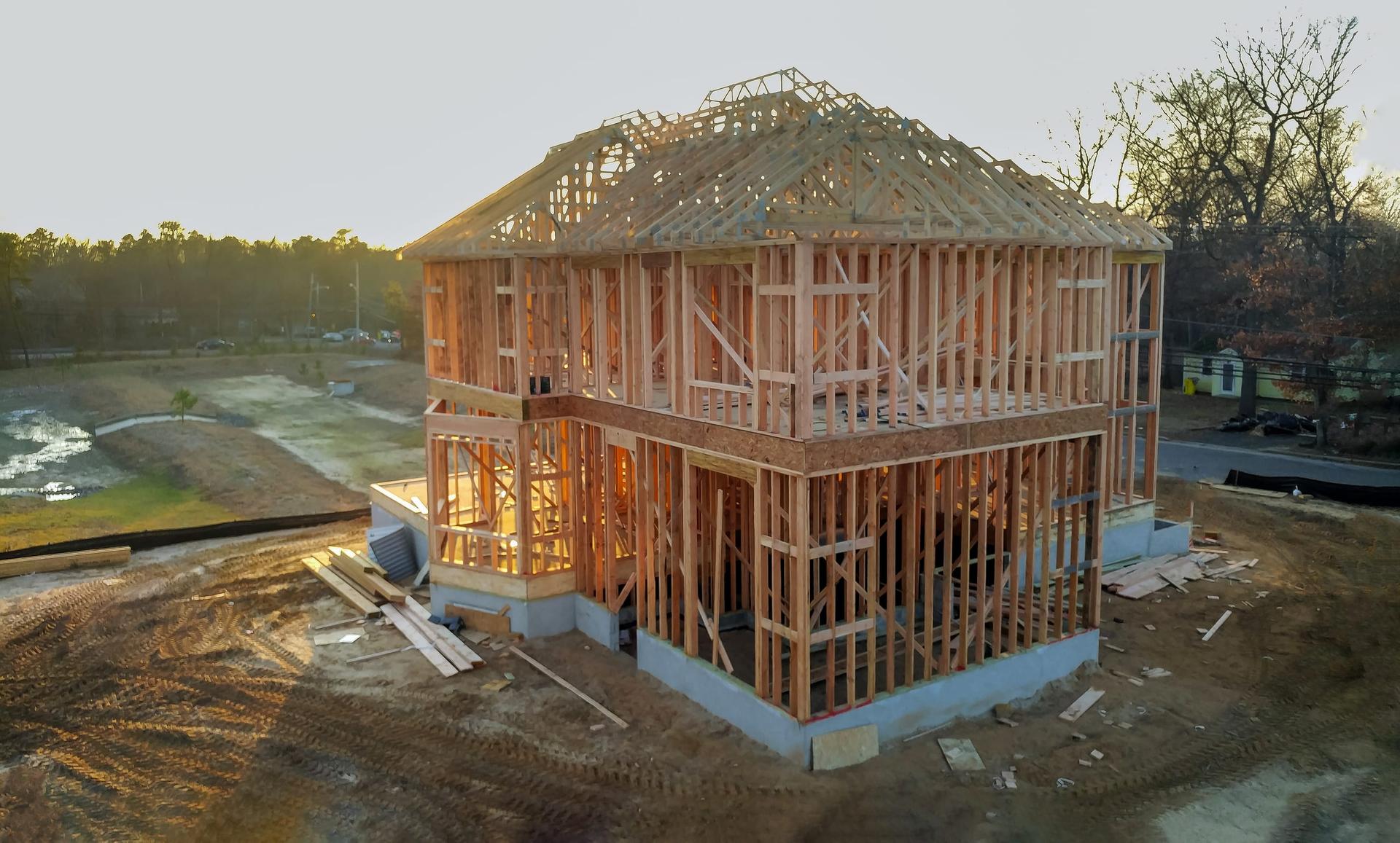 New house under construction with exposed wood framing